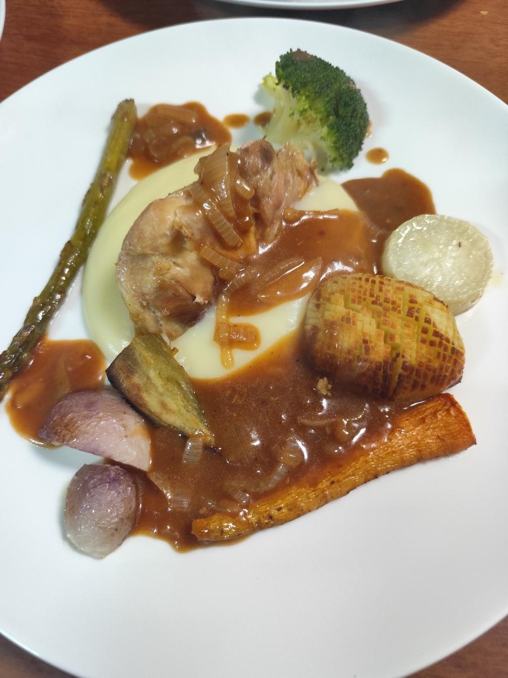 Chicken in onion gravy on mash, with roast root vegetables and asparagus