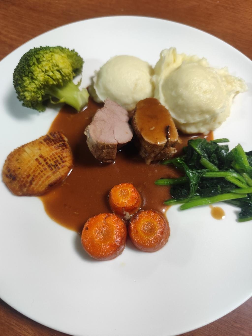 Pork tenderloin, mash, glazed carrots, spinach and roast potato