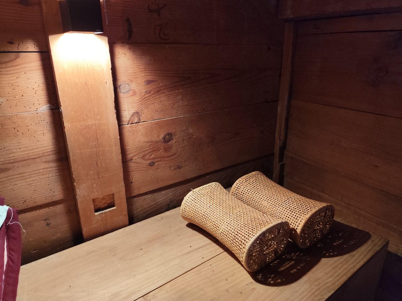 Woven rattan pillows on cedar in the loft